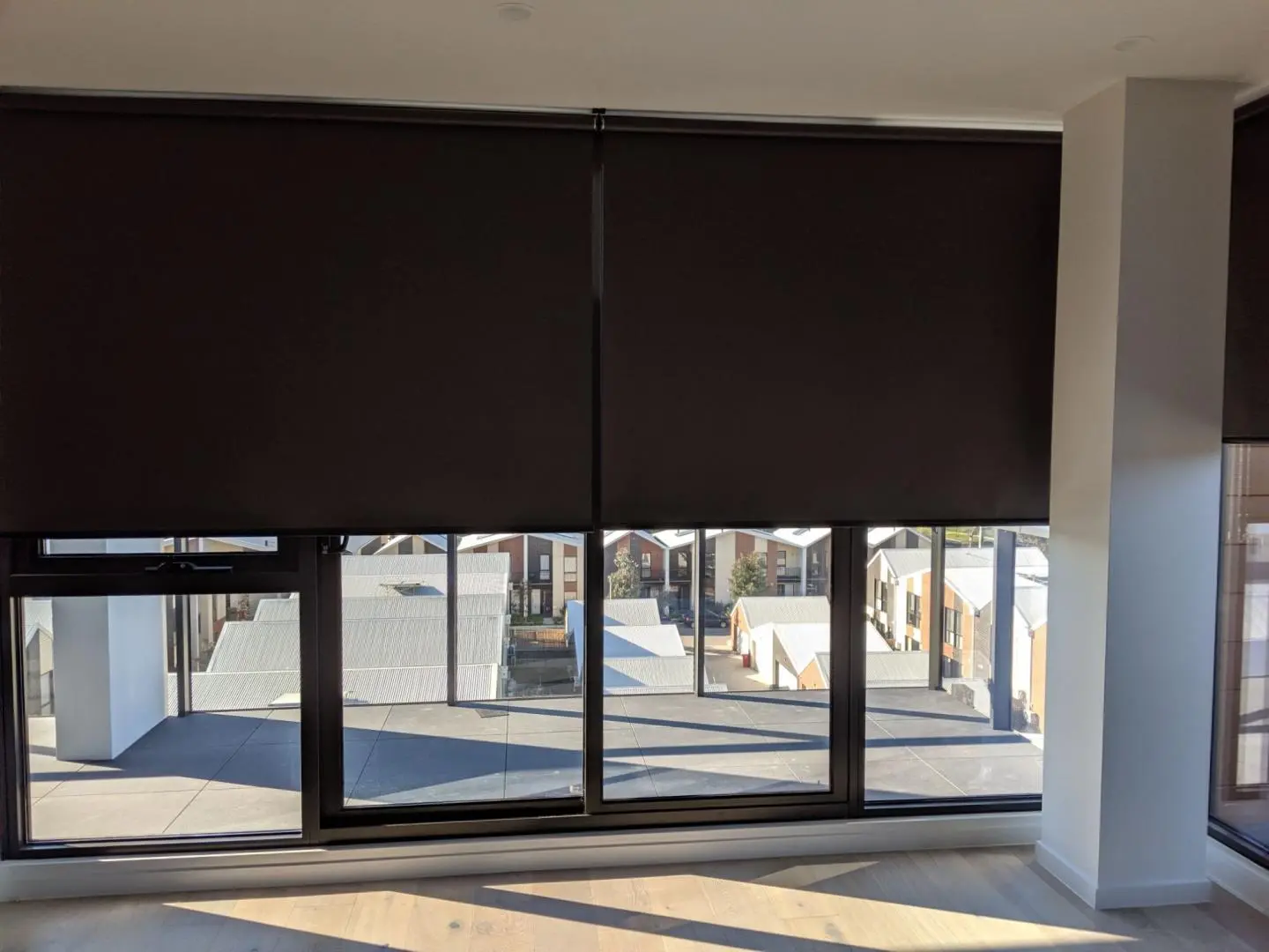 Blackout window blinds offer light control and privacy in a modern room.